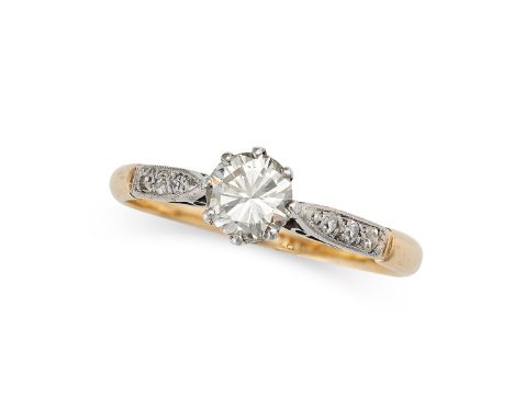 A SOLITAIRE DIAMOND RING in 18ct yellow gold and platinum, set with a transitional cut diamond of 0.62 carats, with further d