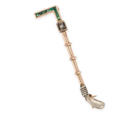 AN ANTIQUE DIAMOND AND EMERALD RIDING CROP BROOCH in 14ct yellow gold and silver, set with a rose cut diamond and step cut em