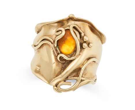 A CITRINE RING in abstract design, set with a cabochon citrine, no assay marks, size Q / 8, 6.3g.&nbsp;