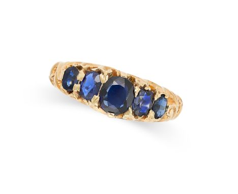 A FIVE STONE SAPPHIRE RING set with a row of graduated oval cut sapphires totalling 1.1-1.2 carats on a stylised band, no ass