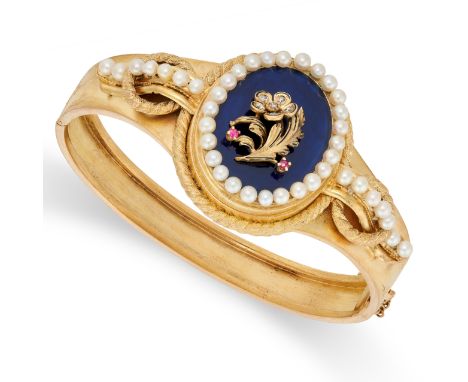 AN ANTIQUE PEARL, RUBY AND ENAMEL BANGLE in yellow gold, with an applied forget me knot flower motif set with rubies and diam