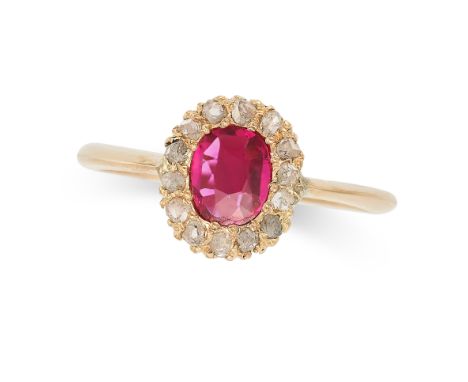 A RUBY AND DIAMOND CLUSTER RING in yellow gold, set with a cushion cut ruby of approximately 0.39 carats in a cluster of rose