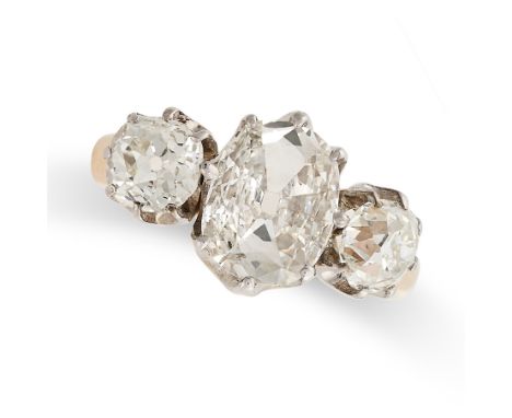 A FINE THREE STONE DIAMOND RING in yellow gold and white gold, set with a principal oval old cut diamond of 1.51 carats, betw