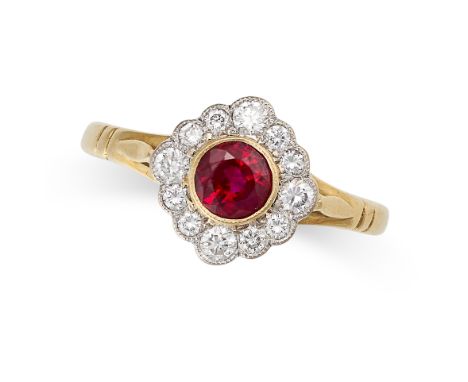 A RUBY AND DIAMOND CLUSTER DRESS RING in 18ct yellow gold, set with a round cut ruby within a border of round brilliant cut d