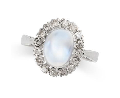 A MOONSTONE AND DIAMOND CLUSTER RING in 18ct white gold, set with an oval cabochon moonstone within a border of round brillia