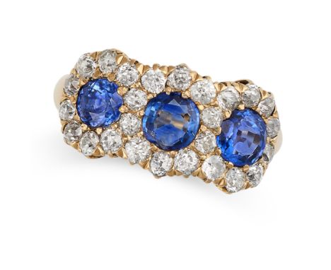 A SAPPHIRE AND DIAMOND DRESS RING in 18ct yellow gold, set with a trio of cushion and round cut blue sapphires within borders