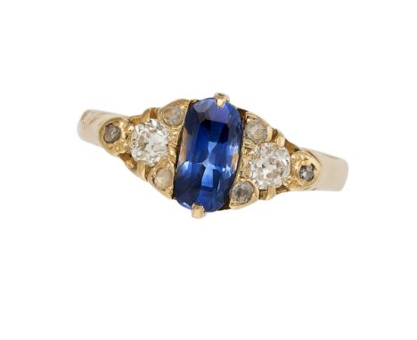 AN ANTIQUE SAPPHIRE AND DIAMOND RING in 18ct yellow gold, set with an elongated cushion cut sapphire of approximately 1.02 ca