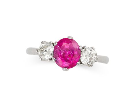 A RUBY AND DIAMOND DRESS RING in 18ct white gold, set with a cushion cut ruby of 1.59 carats between two old European cut dia