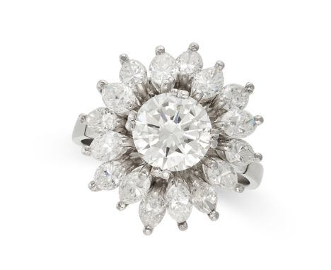 A DIAMOND CLUSTER RING in 18ct white gold, set to the centre with a round brilliant diamond of approximately 1.48 carats in a
