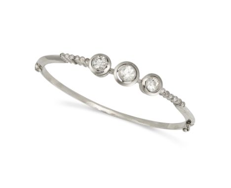 A DIAMOND BANGLE set with three principal old cut diamonds of approximately 0.53, 0.66 and 0.47 carats, further old cut diamo