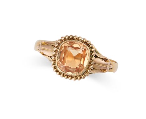 AN ANTIQUE VICTORIAN IMPERIAL TOPAZ DRESS RING in yellow gold, set with a cushion cut topaz of approximately 1.36 carats with