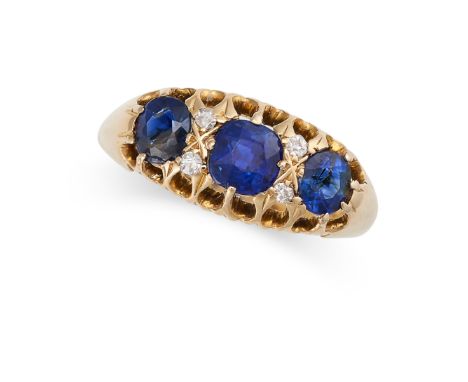 AN ANTIQUE SAPPHIRE AND DIAMOND DRESS RING, 1912 in 18ct yellow gold, set with a trio of graduated cushion cut sapphires acce