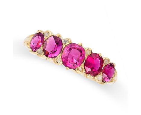 A FIVE STONE RUBY AND DIAMOND RING in 18ct yellow gold, set with five graduated cushion cut rubies accented by rose cut diamo