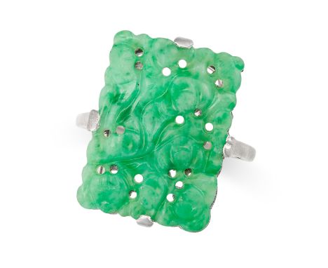 A CHINESE JADEITE JADE DRESS RING set with a rectangular piece of jadeite, carved in the Chinese style to depict foliage and 