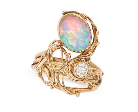 AN OPAL AND DIAMOND RING in 9ct yellow gold, set with an oval cabochon opal and old cut diamond of approximately 0.27 carats,