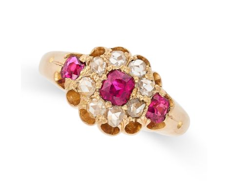 A RUBY AND DIAMOND DRESS RING in 18ct yellow gold, set with a cushion cut ruby in a cluster of rose cut diamonds, accented by