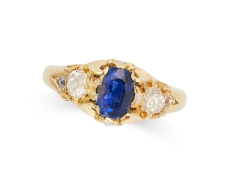 A SAPPHIRE AND DIAMOND RING in yellow gold, set with an oval cut sapphire accented by old cut diamonds on a stylised band, no