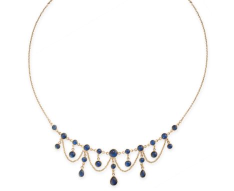 A VINTAGE SAPPHIRE NECKLACE in yellow gold, in fringe design, comprising of a row of cabochon sapphires suspending further sa