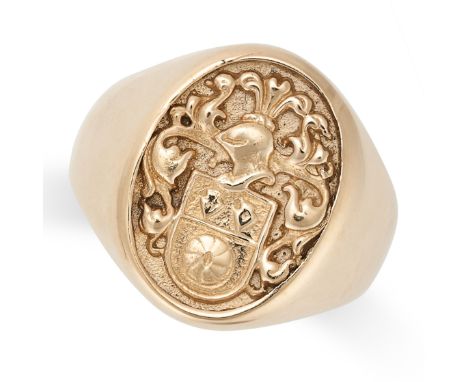 AN ANTIQUE GOLD SIGNET RING in yellow gold, the oval face with a coat of arms in high relief, no assay marks, size R1/2 / 9, 