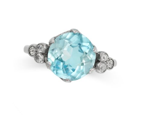 A BLUE ZIRCON AND DIAMOND RING set with a round cut blue zircon of approximately 3.73 carats accents by trios of old cut diam