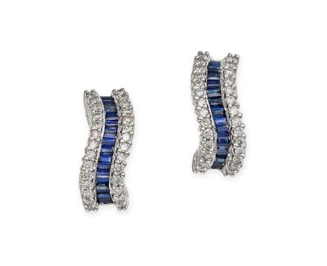 A PAIR OF SAPPHIRE AND DIAMOND HALF HOOP EARRINGS in 18ct white gold, each set with a row of step cut sapphires between two c