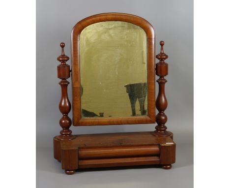 A Victorian mahogany dressing mirror with turned finial supports and single drawer to the base.