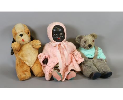 A black pot doll with painted face, along with a sweep cuddly toy and a vintage mo-hair stuffed teddy with glass eyes.