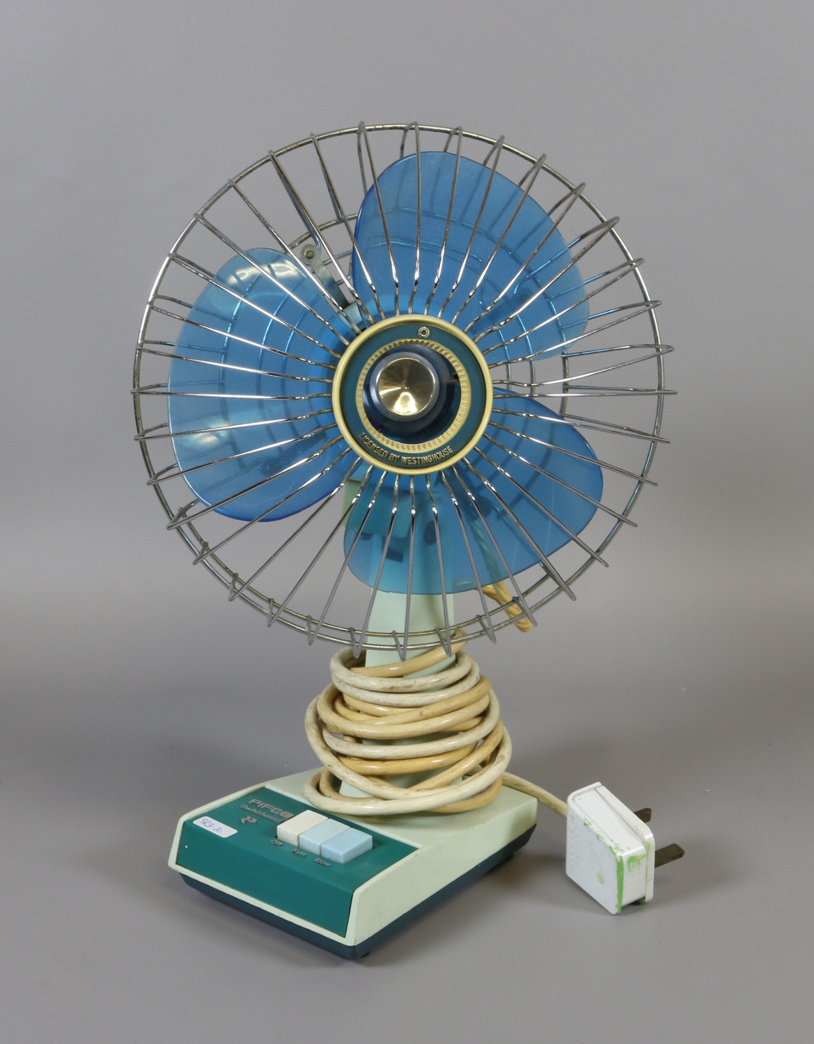 A retro 1970 Pifco Whirlwind desk fan.