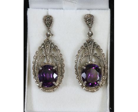 A pair of silver marcasite and amethyst pendant earrings.