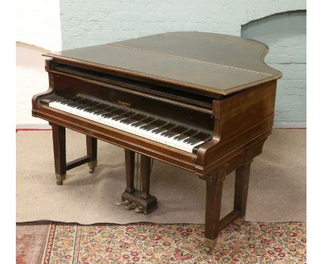 A mahogany veneer Baby Grand piano by George Steck, along with piano stool.