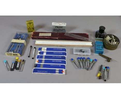 A collection of drawing accessories, bilateral slide rule, compass and various leads.