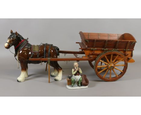 A mid C20th ceramic shire horse with open wagon.