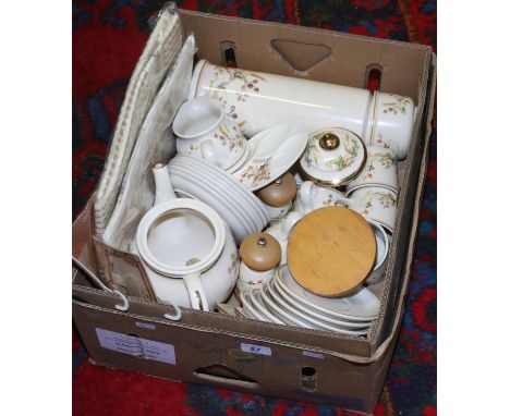 A box lot of Harvest pattern oven to table wear including flask, table clothes, cups and saucers etc.