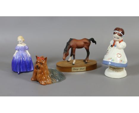 Four collectable ceramic figures; Royal Dux figure of a young girl, Beswick model of a foal, Royal Doulton figurine Marie 8N 