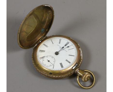 A brass cased full hunter pocket watch New York Standard Watch Co. with enamel dial and subsidiary seconds.