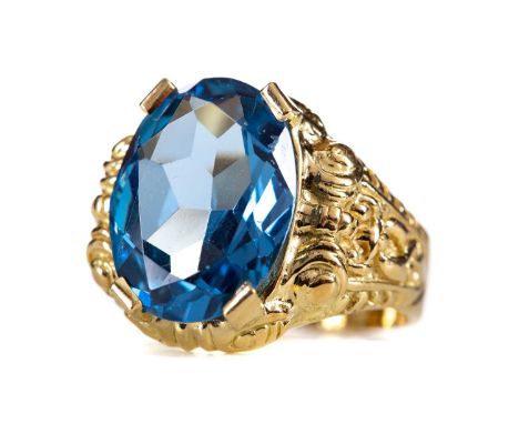 TOPAZ RING,the oval faceted topaz to an ornate eighteen carat gold shank, size O, 9.7g