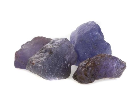 **FIVE CERTIFICATED UNMOUNTED GEMSTONES,including a parcel of 31.35 carat rough amethyst, 21.84 carat rough ruby, parcel of 6
