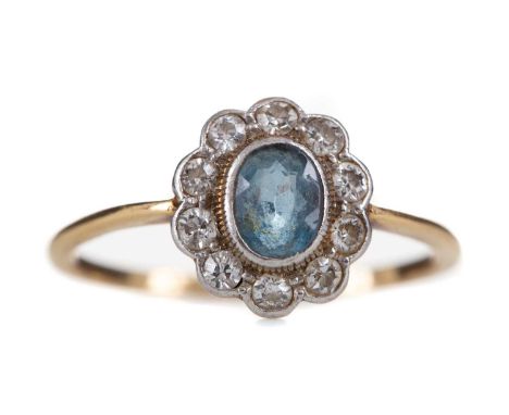 TOPAZ AND DIAMOND CLUSTER RING,the oval topaz within a halo of round brilliant cut diamonds totalling approximately 0.40 cara