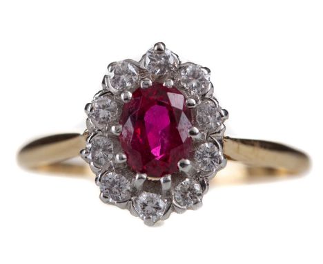 RUBY AND DIAMOND CLUSTER RING,the oval ruby within a halo of round brilliant cut diamonds totalling approximately 0.40 carats