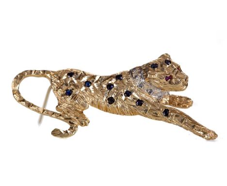 GEM SET PANTHER BROOCH,the reclining panther set with round sapphires, ruby eyes and diamond collar, 52mm long, in nine carat