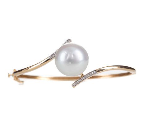 SOUTH SEA PEARL AND DIAMOND BANGLE,the central pearl flanked by two diamond set terminals, in eighteen carat gold, 21.9gLight