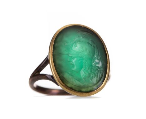 GREEN INTAGLIO RING,carved depicting the bust of Hermes, to a yellow metal shank, size O 1/2, 5.2g