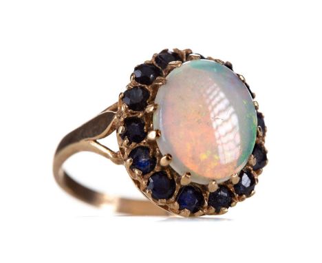 OPAL AND SAPPHIRE RING,set with an oval opal within a sapphire halo, in nine carat gold, size M, 4g      