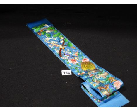 A Finely Worked Blue Ground Oriental Sash Delicately Woven With Blossom & Bird Scenes