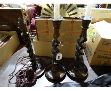 A Pair Of Oak Twist Candle Holders Together With A Similar Table Lamp