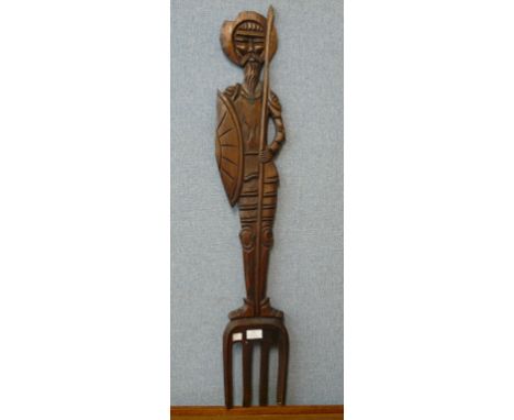 A large carved wood fork 