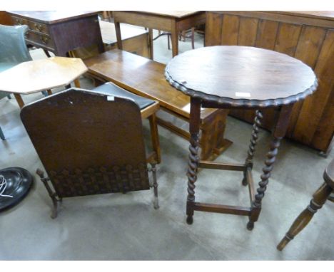 An oak barleytwist occasional table and a copper fire screen 