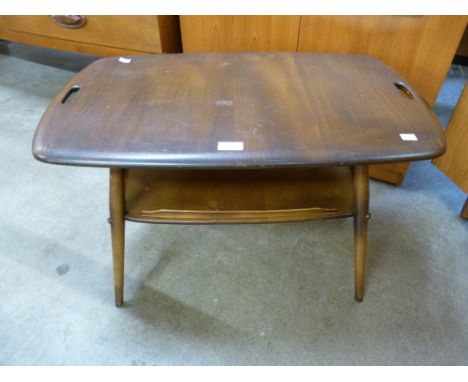 An Ercol Golden Dawn elm and beech butlers tray table 