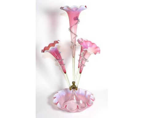 A Large Pink Vaseline Glass Epergne, with frilled rims, the central trumpet vase flanked by three further trumpet vases, on a