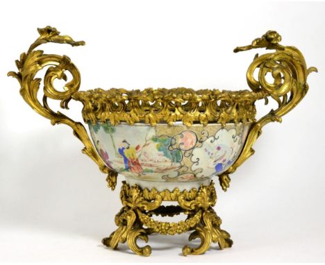 A Gilt Metal Mounted Chinese Porcelain Punch Bowl, Qianlong, painted in famille rose enamels with panels of figures in landsc